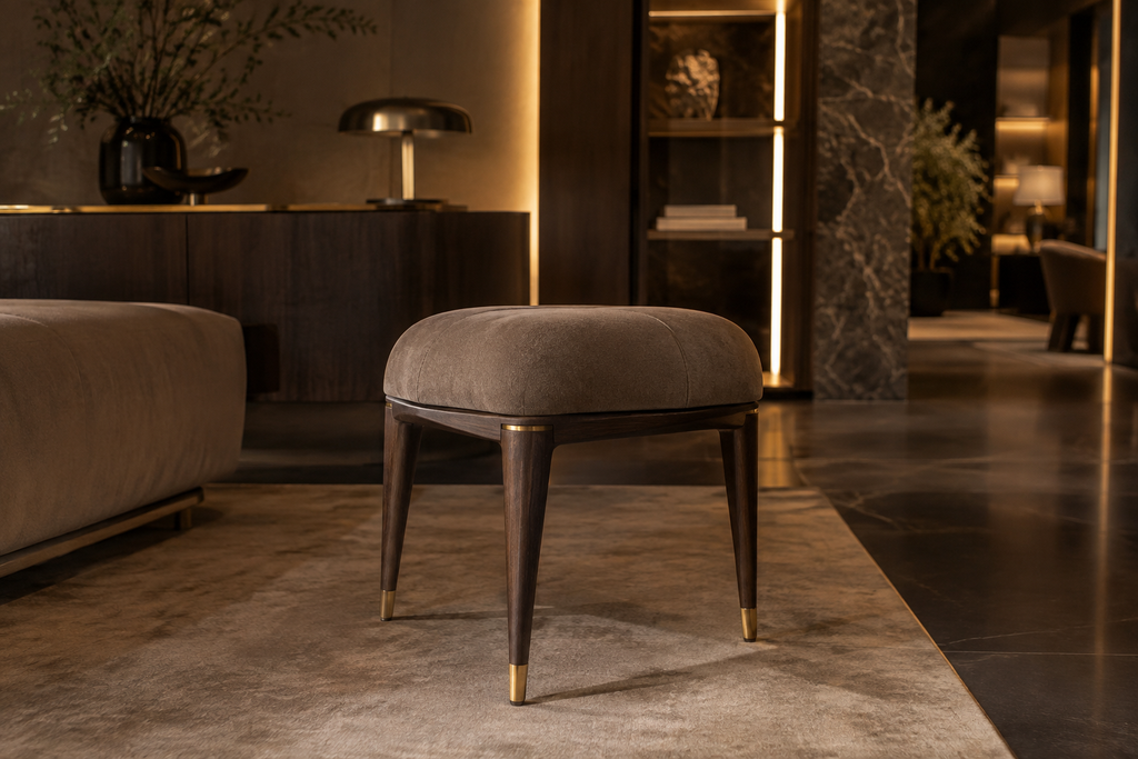 Luxury upholstered accent stool in an elegant showroom